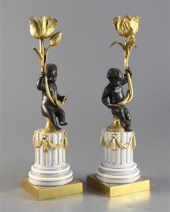 A pair of Louis XVI style bronze and ormolu candlesticks 11in.